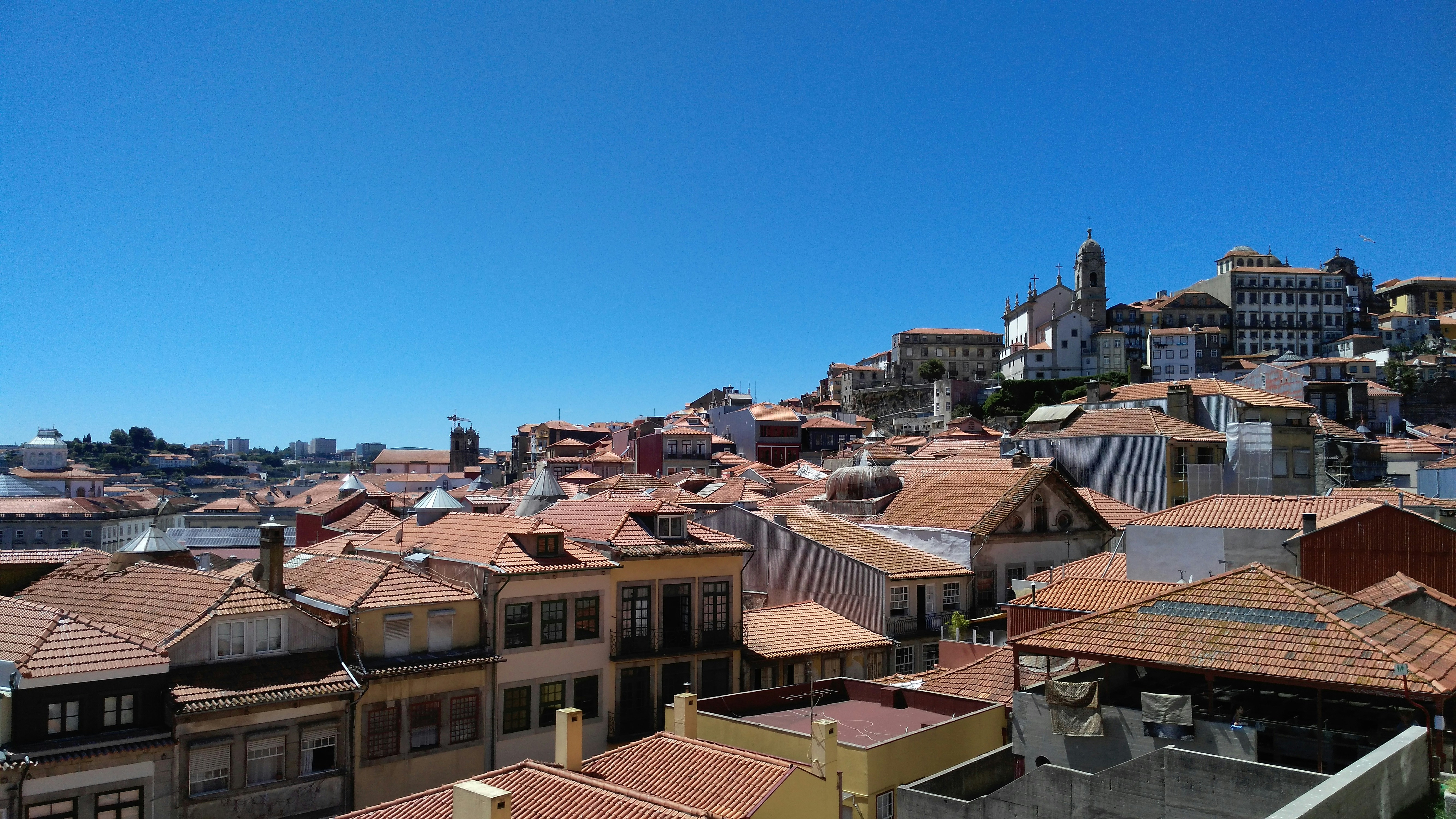 a view of a city from a hill, 