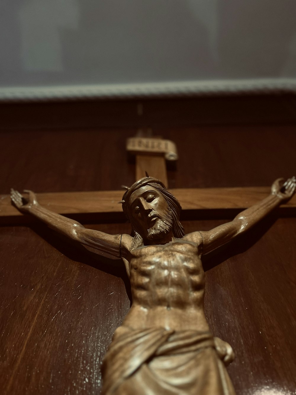 a statue of jesus on a wooden cross