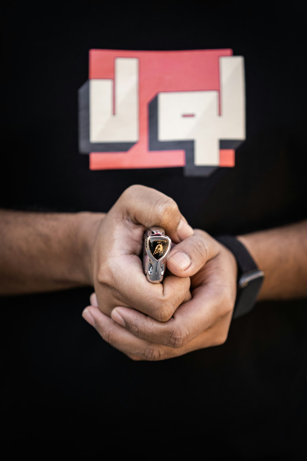 a man holding a cigarette in his hand