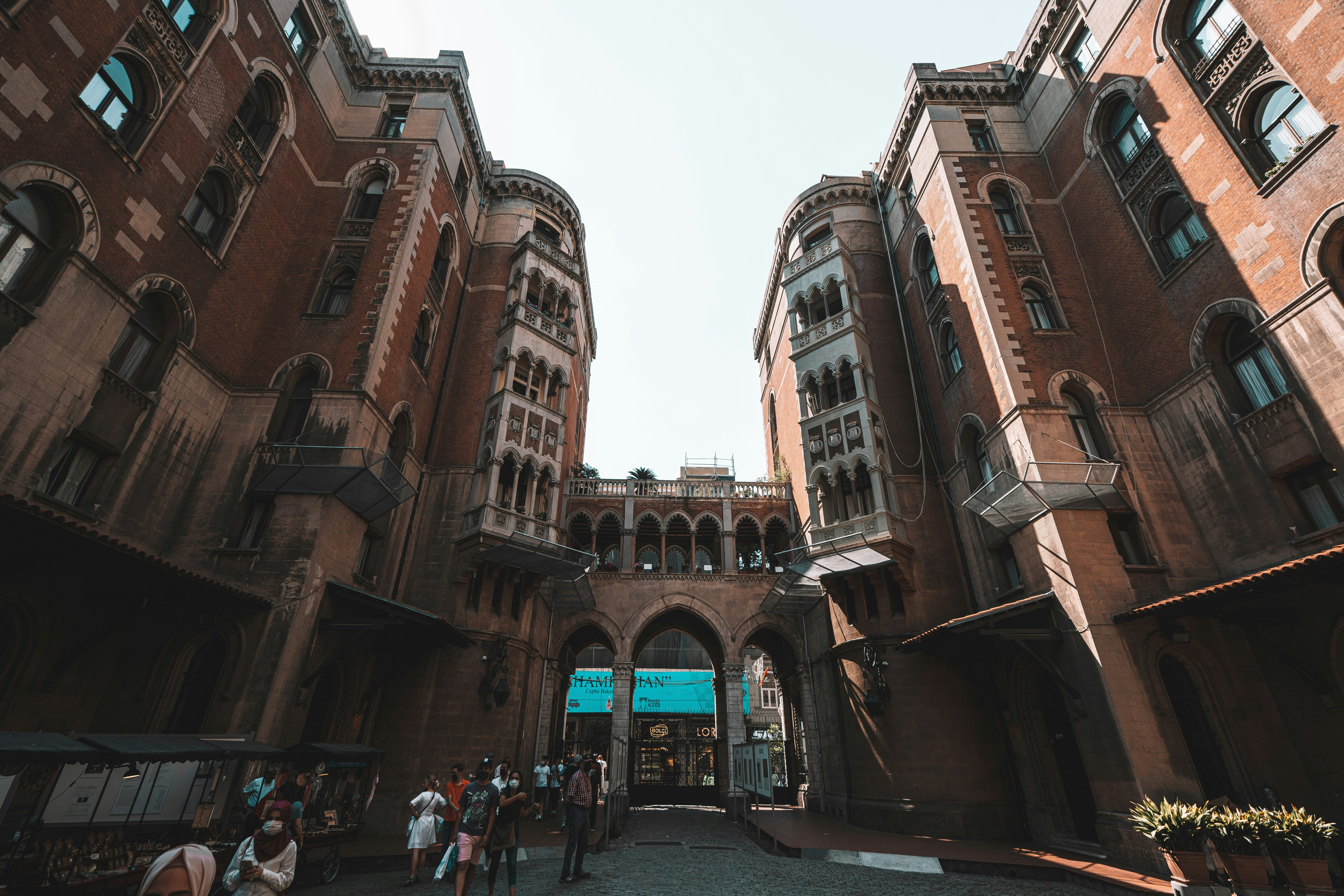 a group of people standing in front of a tall building