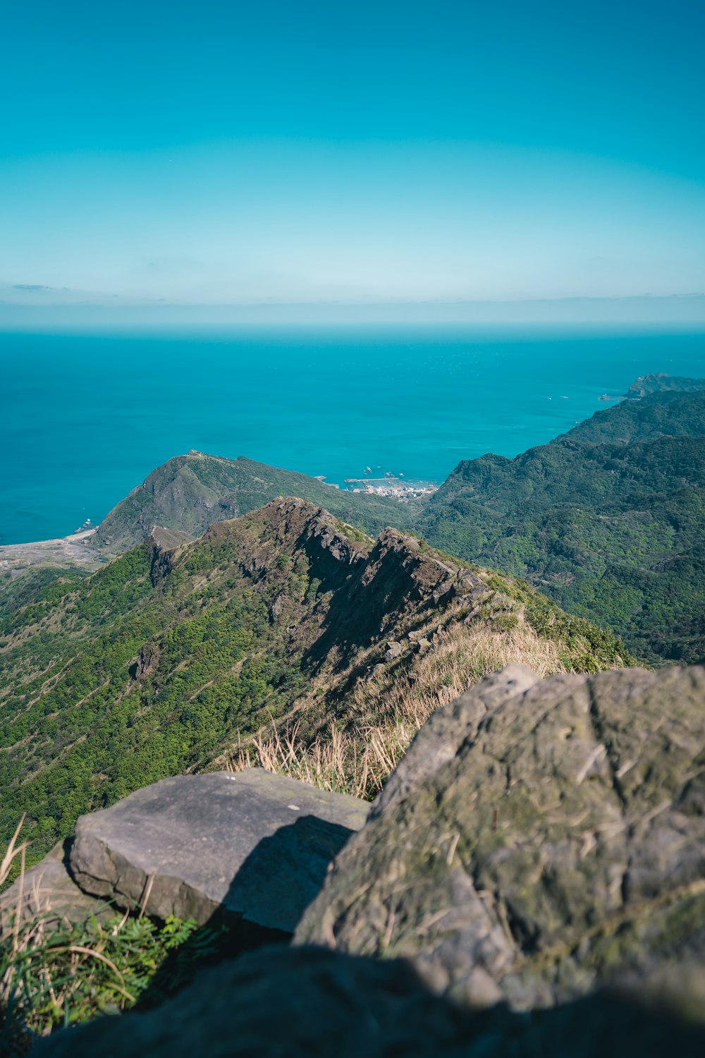 the view from the top of a mountain overlooking the ocean