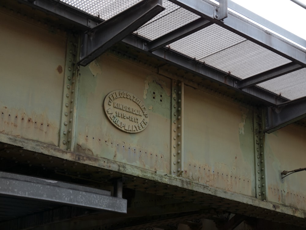 a close up of a bridge with a sign on it