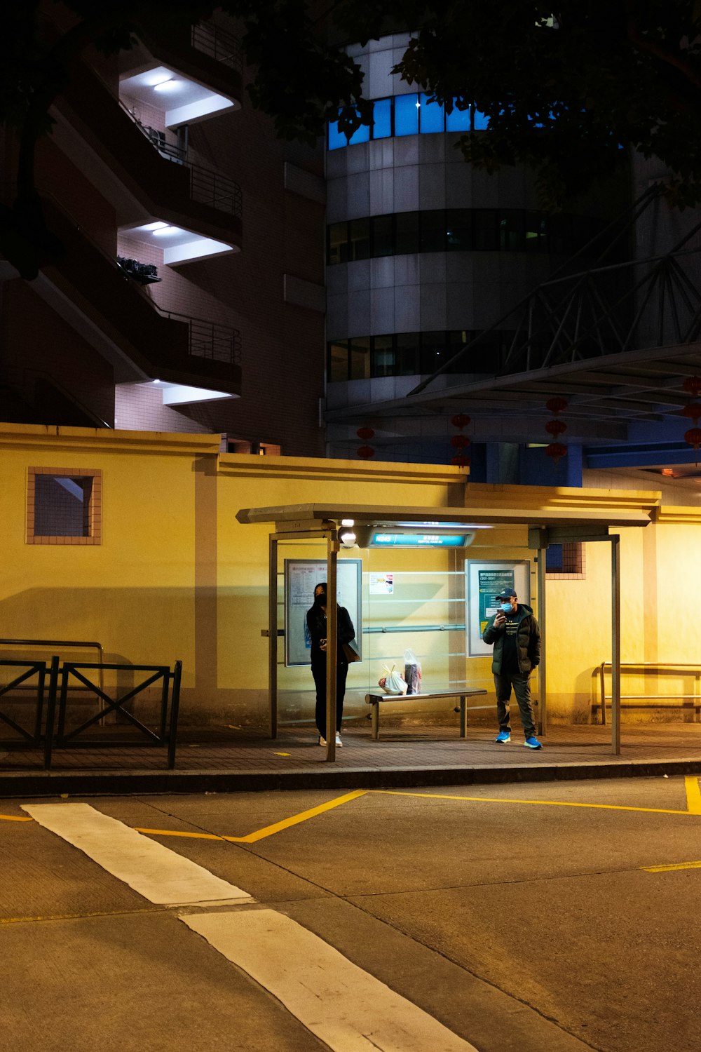 a couple of people that are standing outside of a building