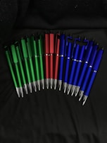 A collection of restored pens arranged neatly with ample white space around them.