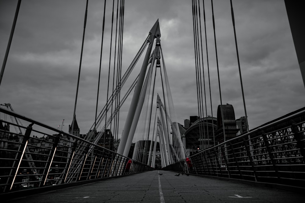 a black and white photo of a bridge