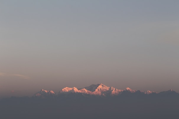 An inspiring image of a sunrise over mountains.