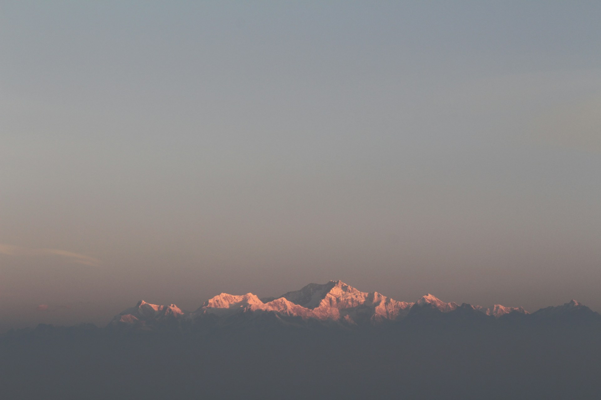 woman wearing yellow long-sleeved dress under white clouds and blue sky during daytime