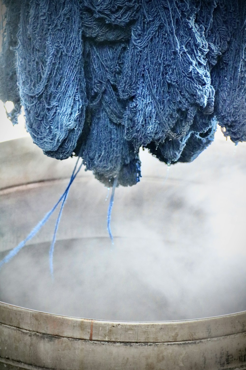 a close up of a blue cloth hanging from a pole