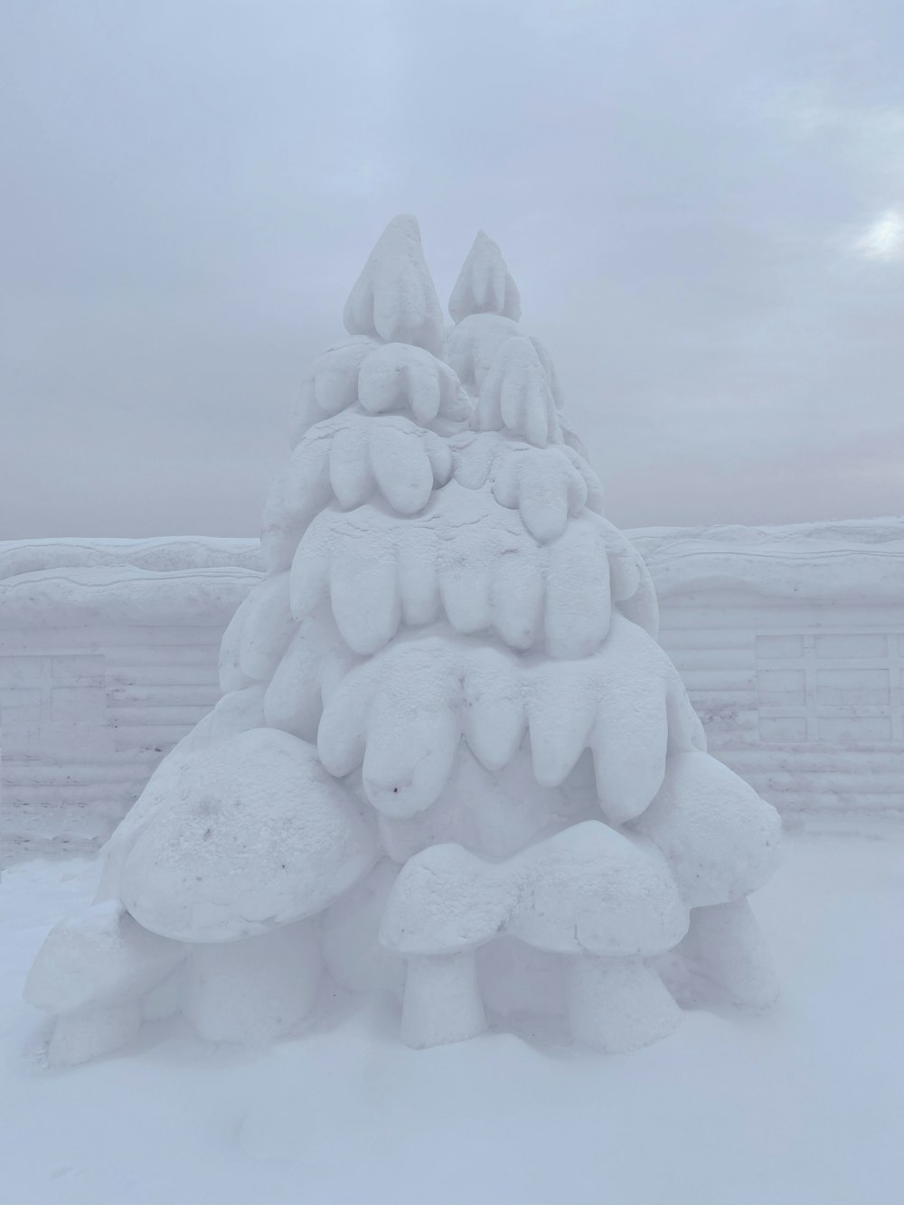 a snow sculpture of a tree made of snow