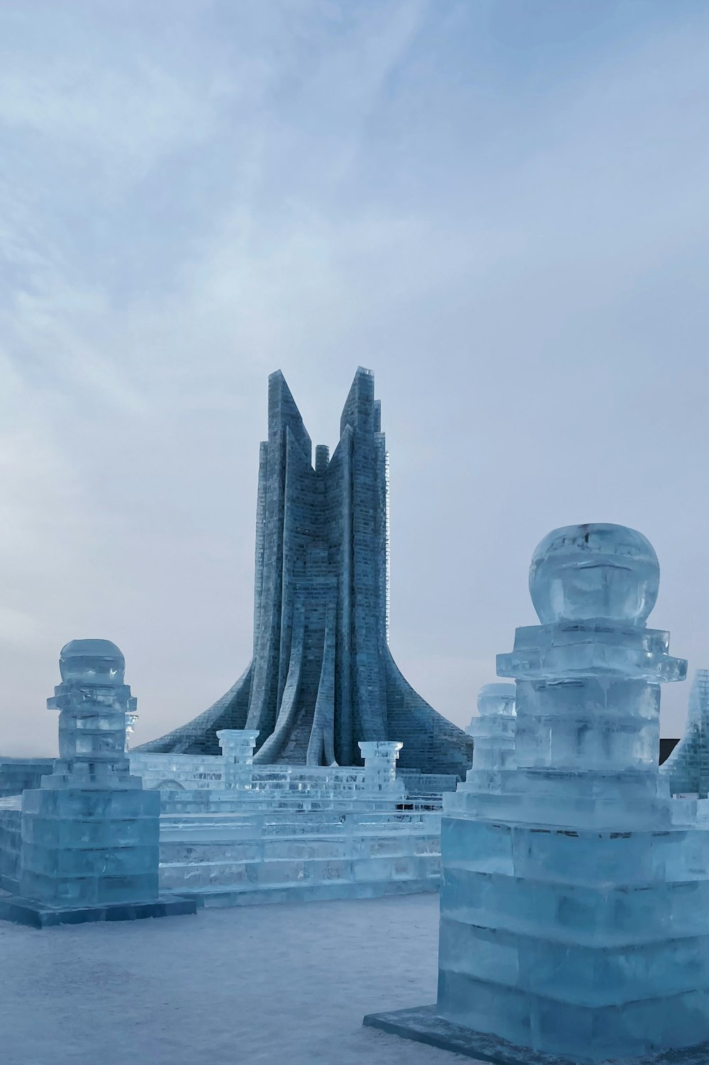 a large ice sculpture sitting on top of a frozen lake