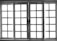 A set of white-framed sliding glass doors with multiple square panes, allowing bright light to pass through, creating a high contrast between the dark frame and the bright background.