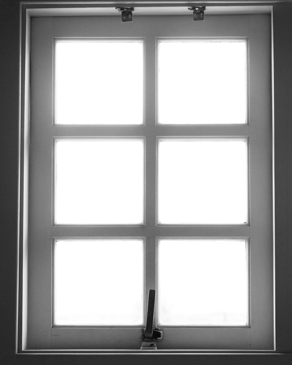 a black and white photo of a window