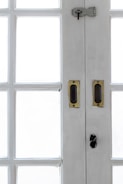 A close-up of a fire door's hardware and seals.