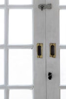 Close-up of a newly installed multi-point locking system on a commercial entrance.