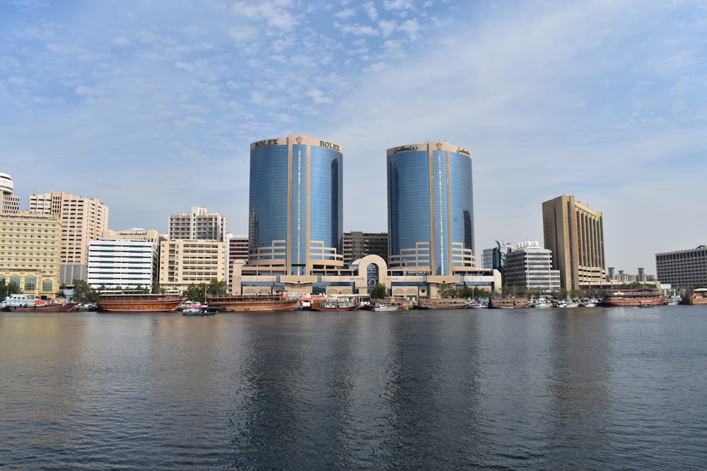 a large body of water with a city in the background