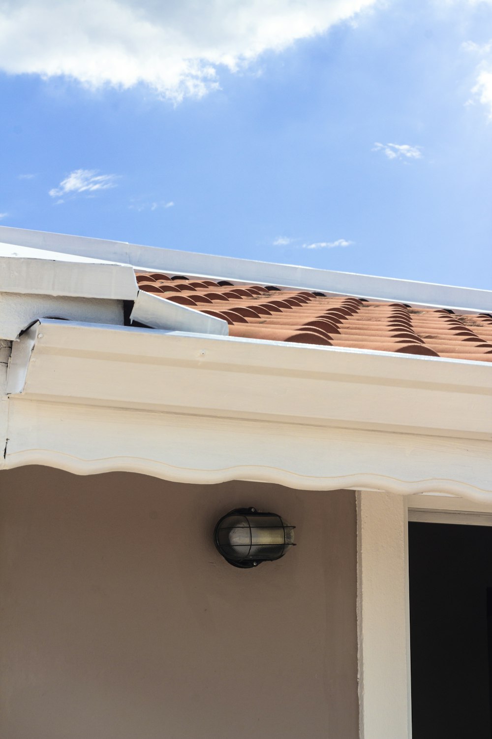 a close up of a roof with a sky background