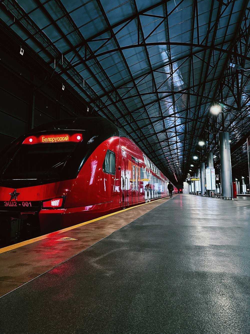 a red train parked at a train station