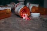 a close up of a bottle of pills on a table