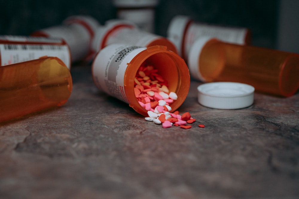 a close up of a bottle of pills on a table
