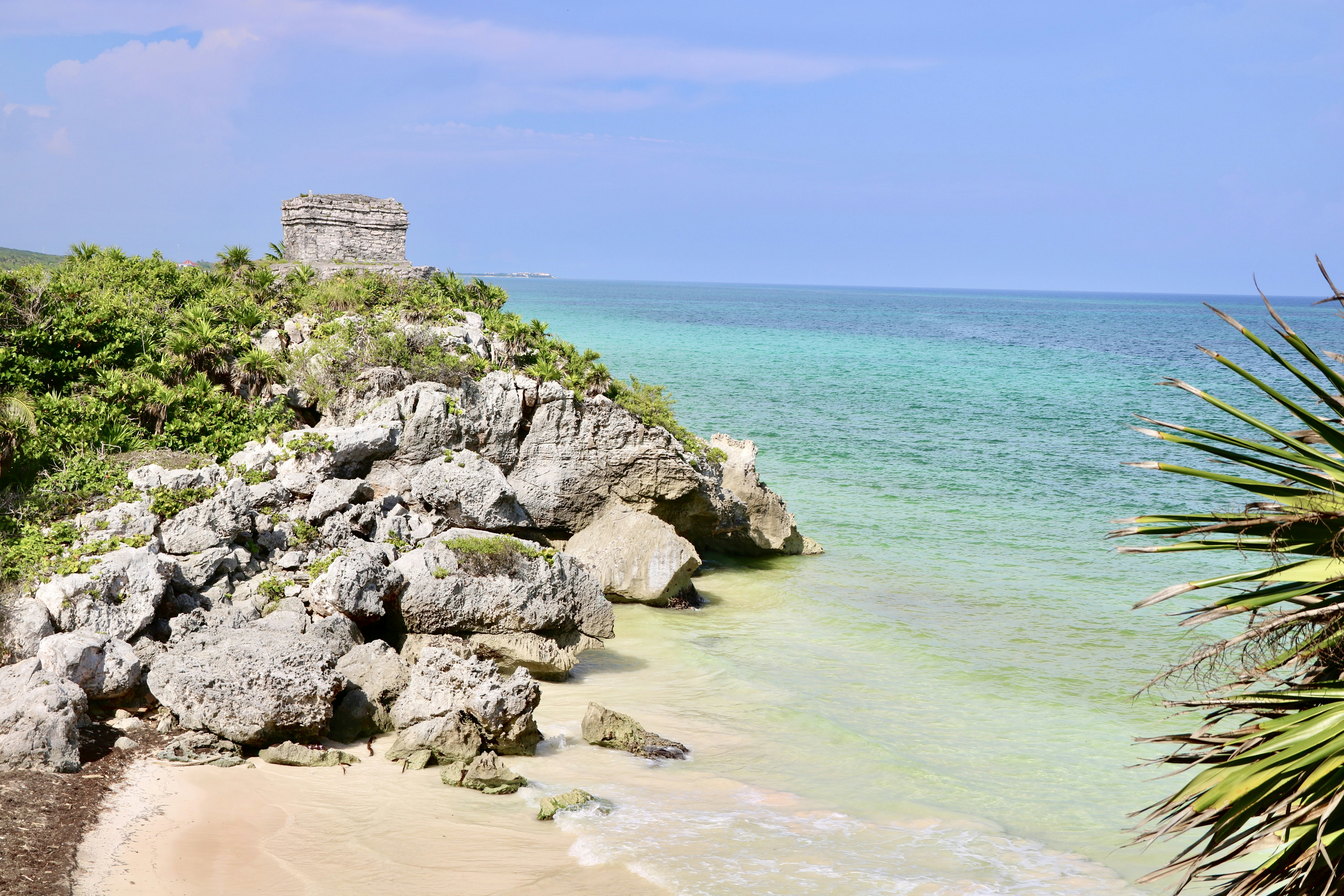 a view of the ocean from a rocky cliff
