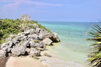 a view of the ocean from a rocky cliff