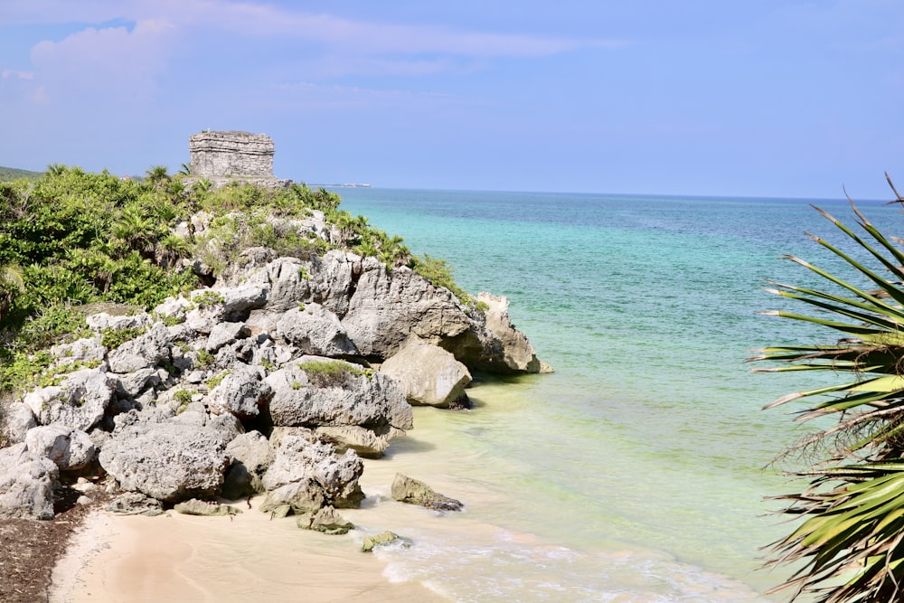 a view of the ocean from a rocky cliff