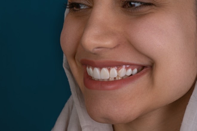 a close up of a woman with a smile on her face