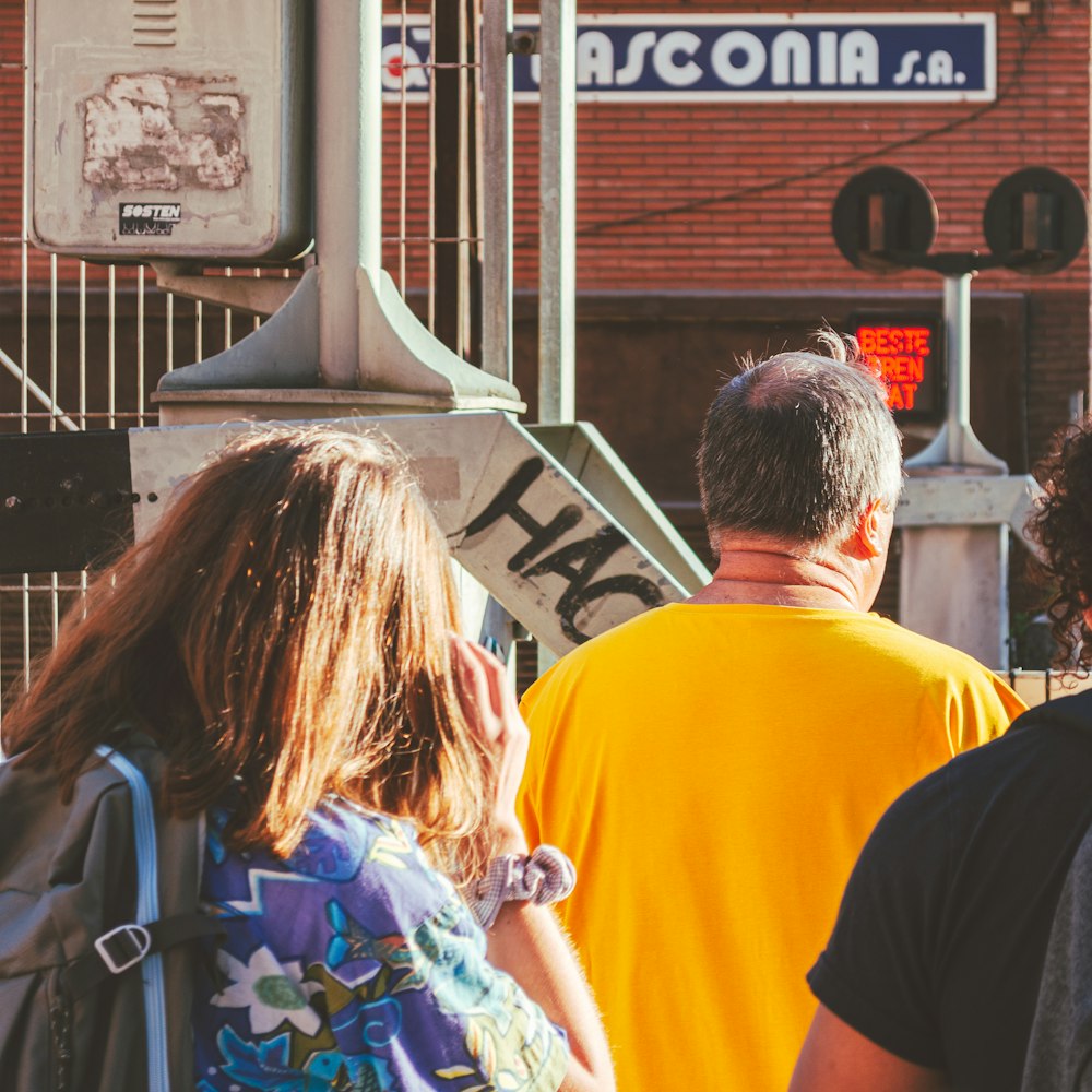 a group of people walking down a street