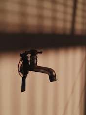a faucet that is sitting on a wall