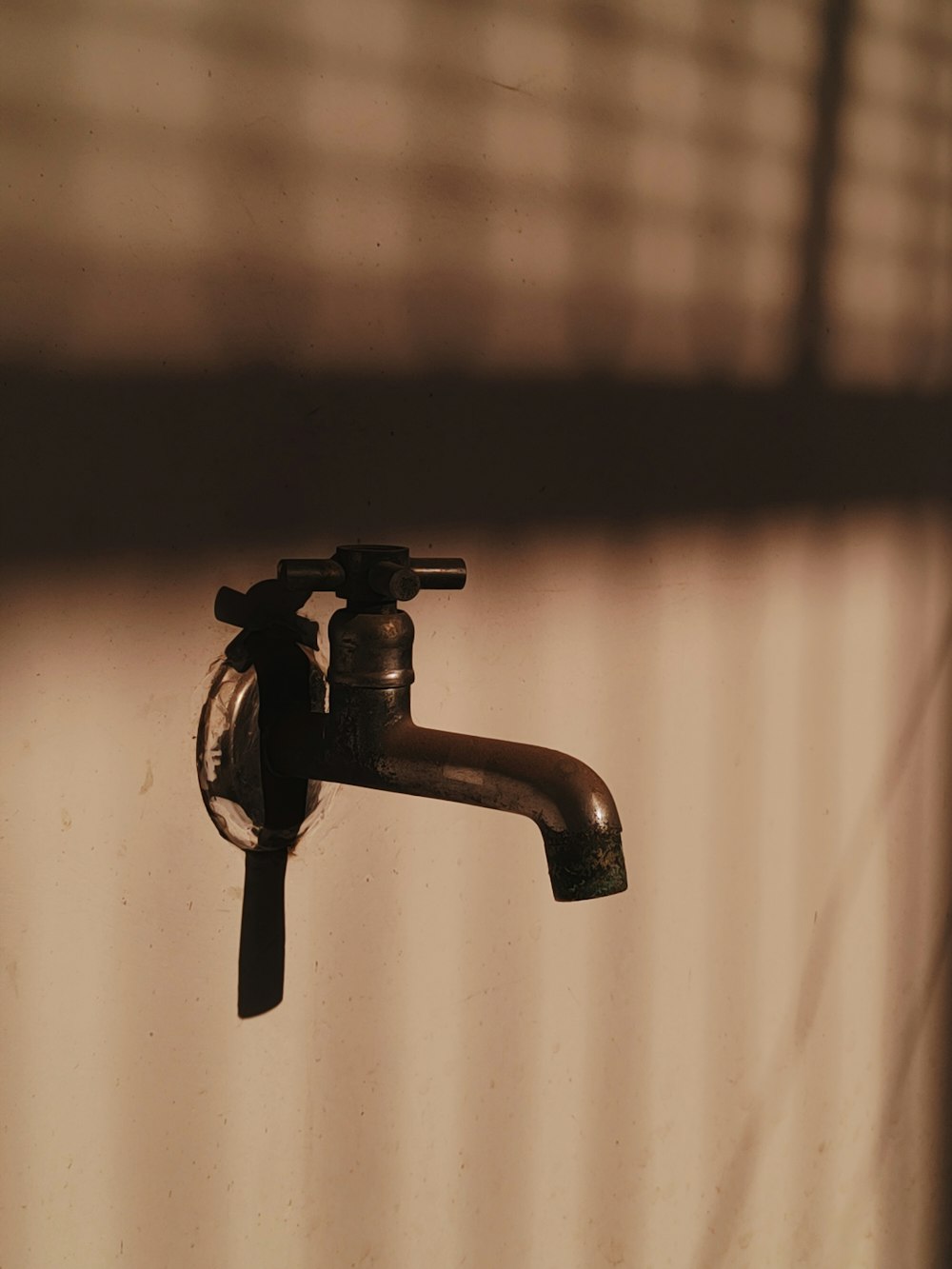 a faucet that is sitting on a wall