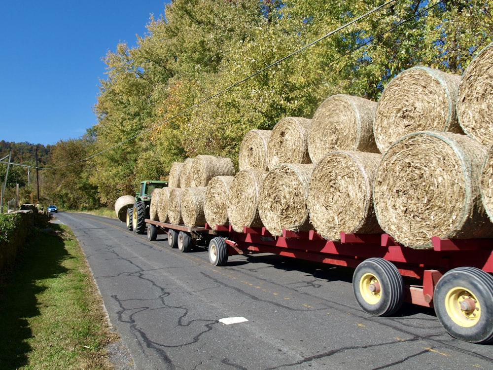 a truck with hay bales on the back of it