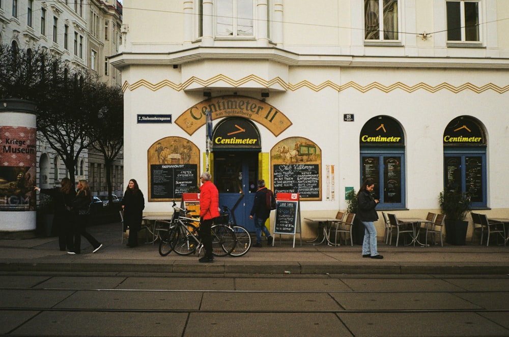 a group of people standing outside of a building