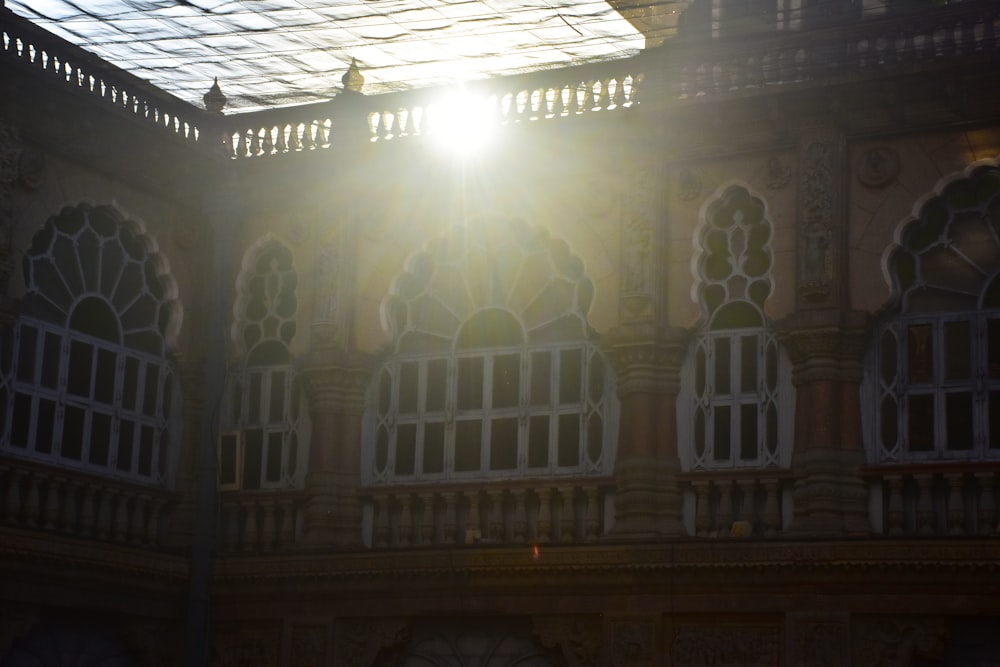 the sun is shining through the windows of a building