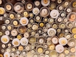 A vibrant collection of buttons and sewing supplies in jars.