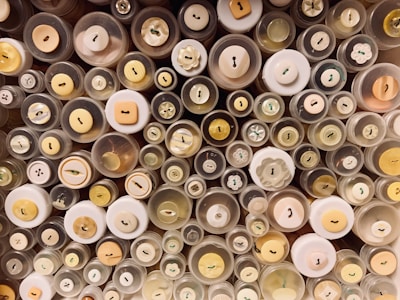An assortment of colorful buttons arranged neatly.