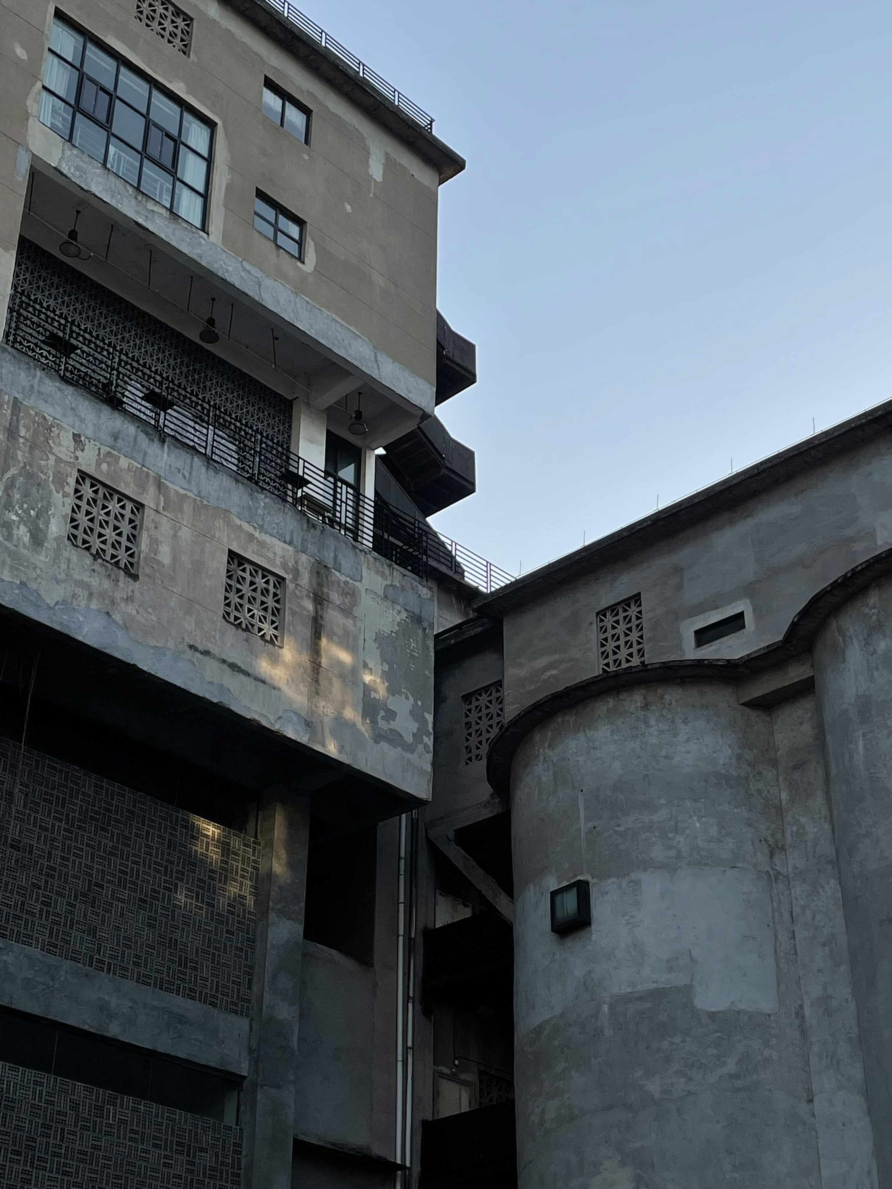 a tall building with a clock on the side of it