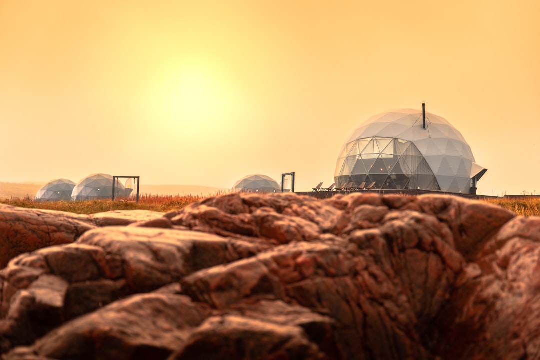 a group of domes sitting on top of a rocky hillside,