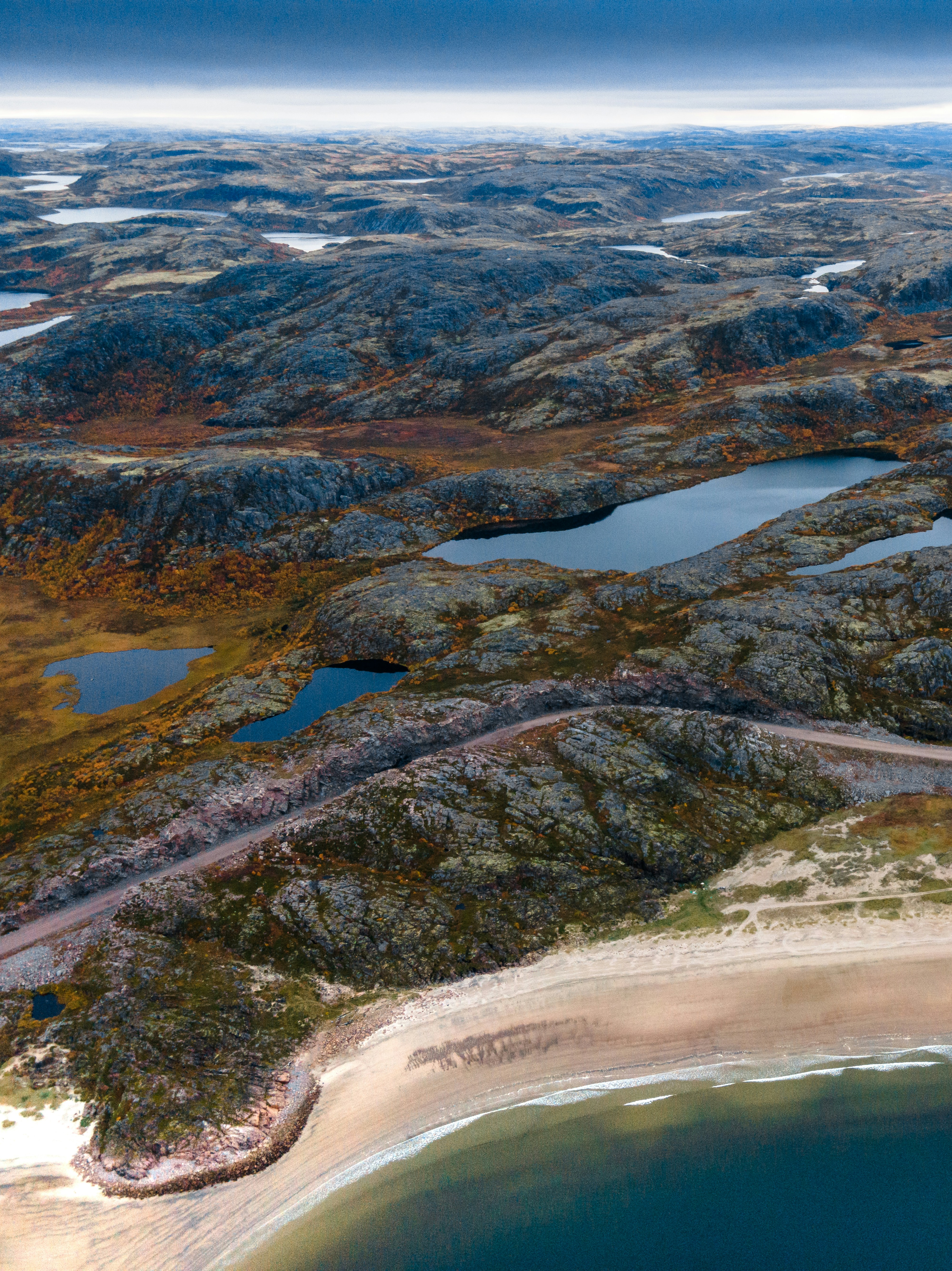 an aerial view of a beach and a body of water