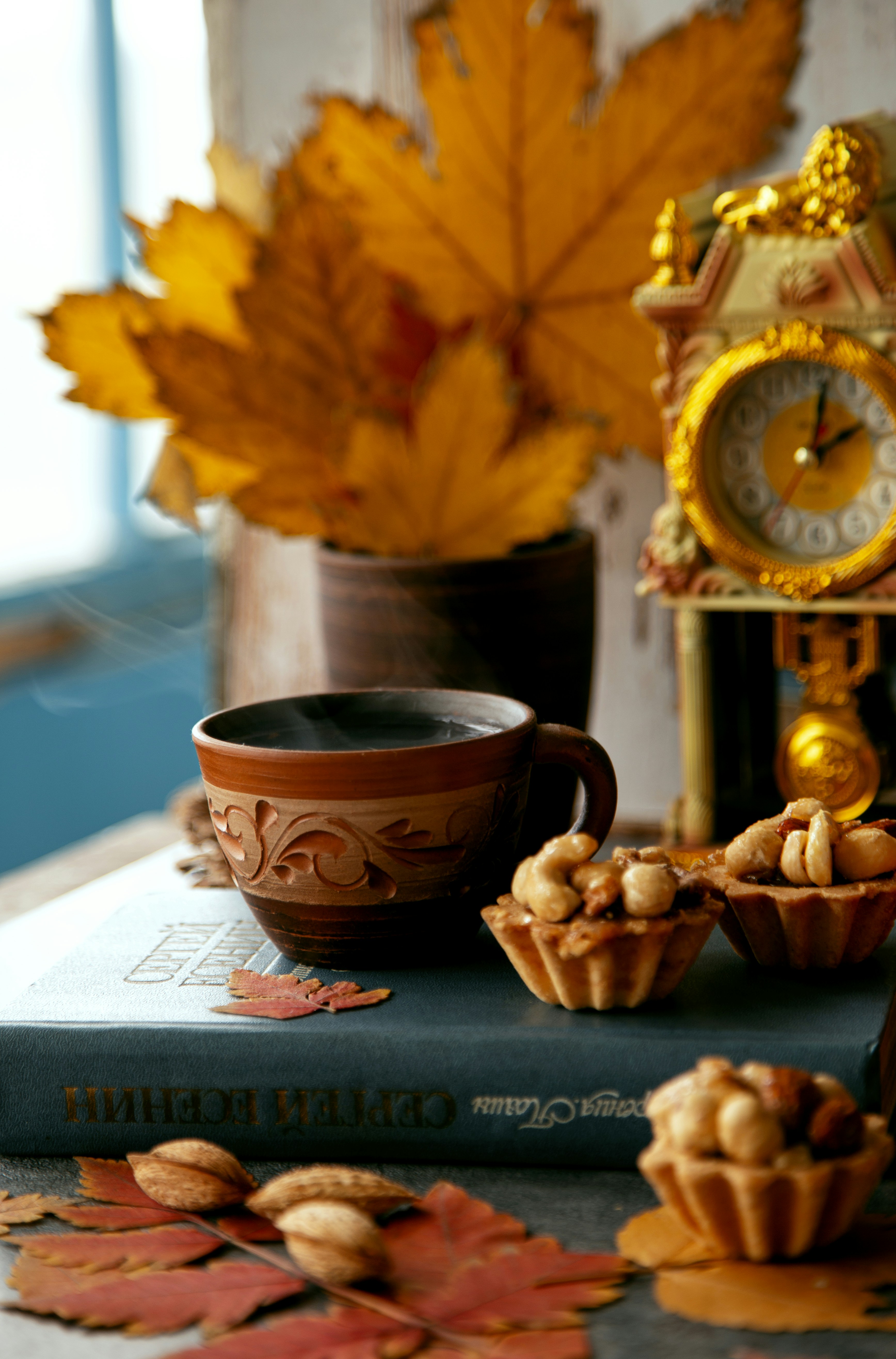 a cup of coffee sits on top of a book