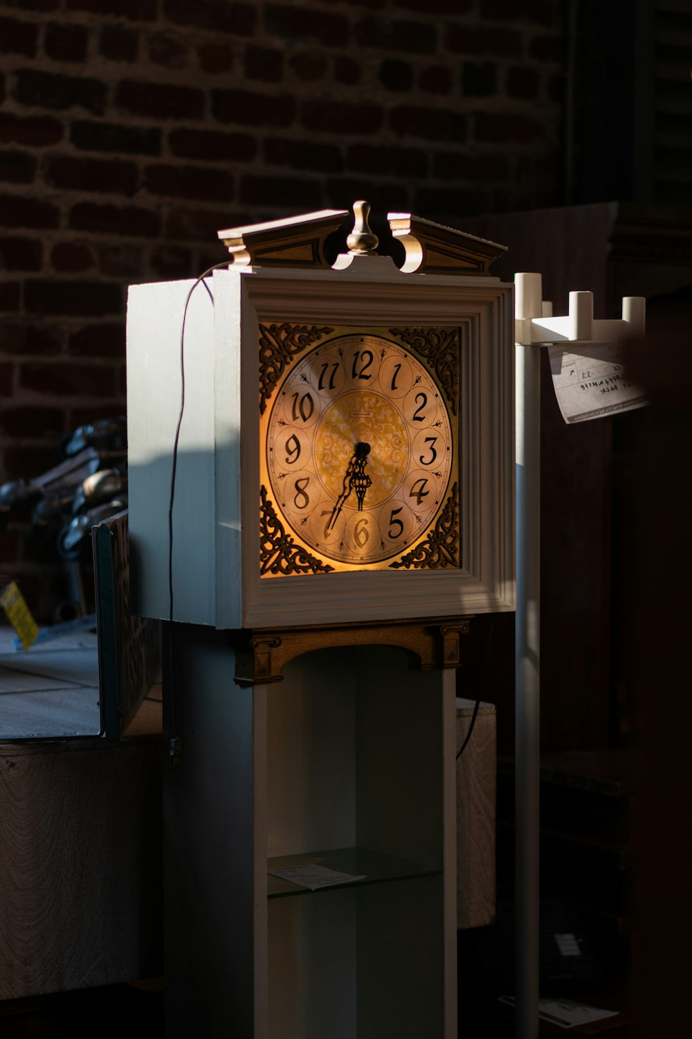 a clock that is on top of a shelf