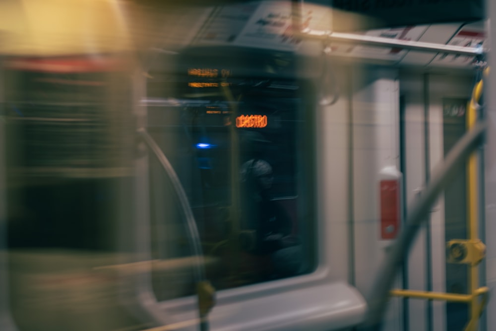 a blurry photo of a subway car with the door open
