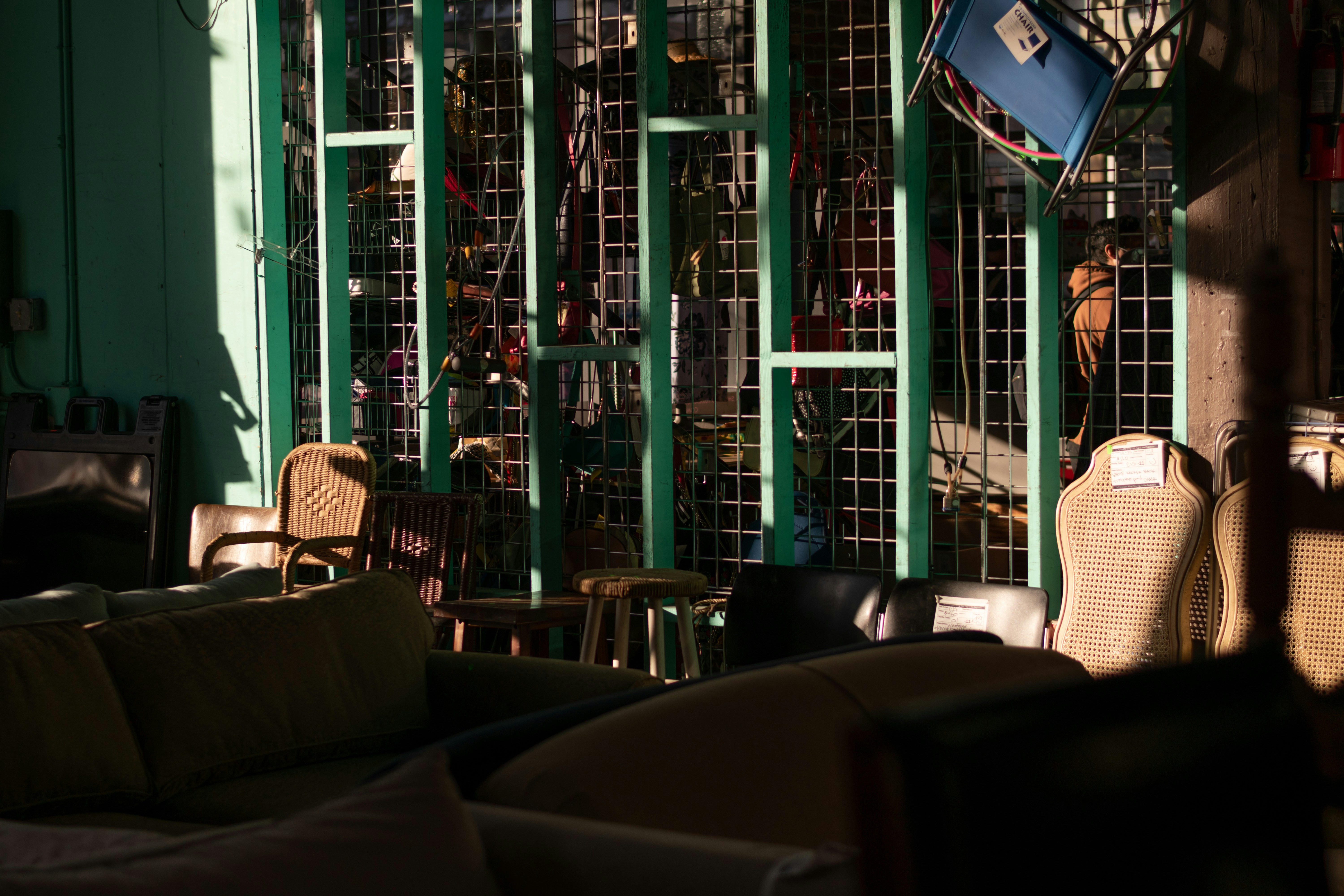 a living room filled with furniture and lots of windows