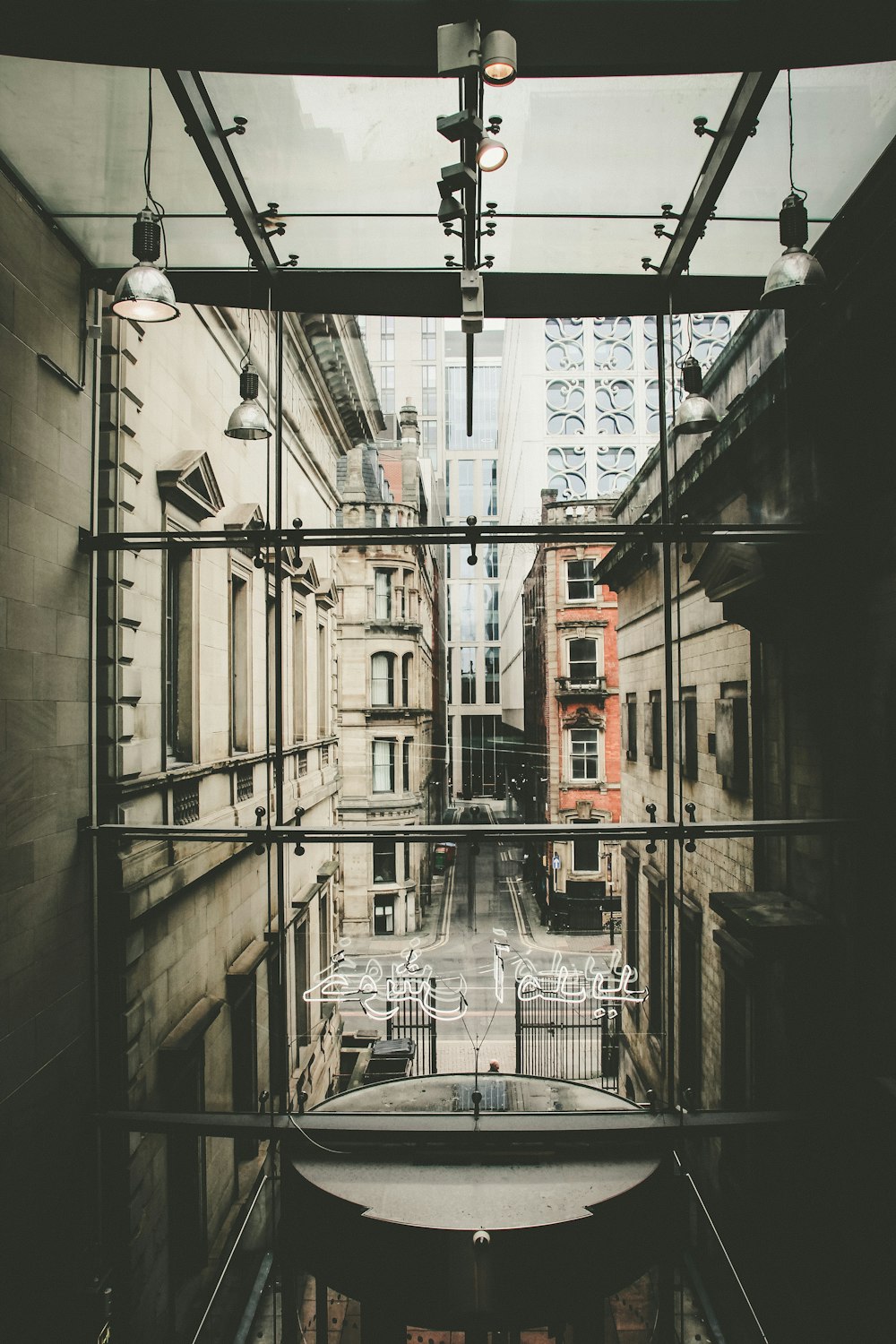 a view of a city through a glass window