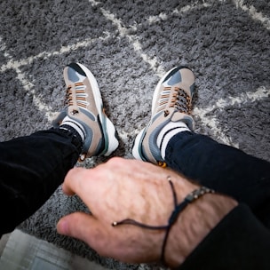 a man is holding the hand of another man