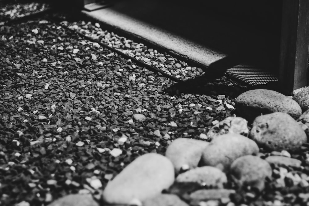 a black and white photo of rocks and gravel