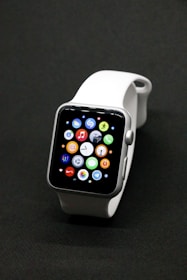 A sleek smartwatch displayed with various interchangeable bands.