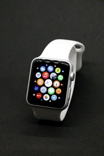 A sleek smartwatch displayed with various interchangeable bands.