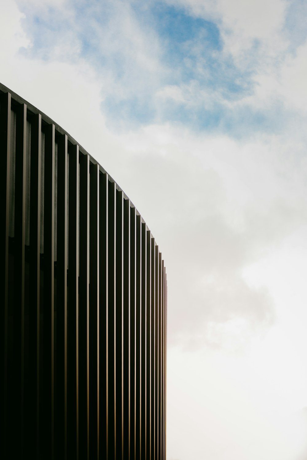 a tall building with a sky in the background