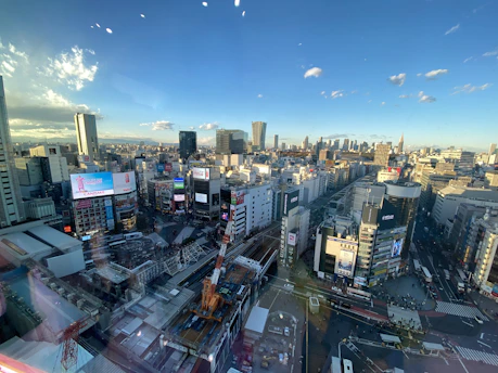 A bustling cityscape at dawn with skyscrapers and busy streets, symbolizing the dynamic world of economy and politics.
