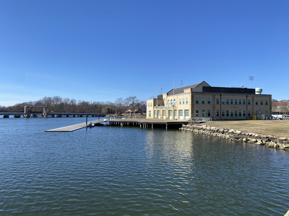 a large building sitting next to a body of water